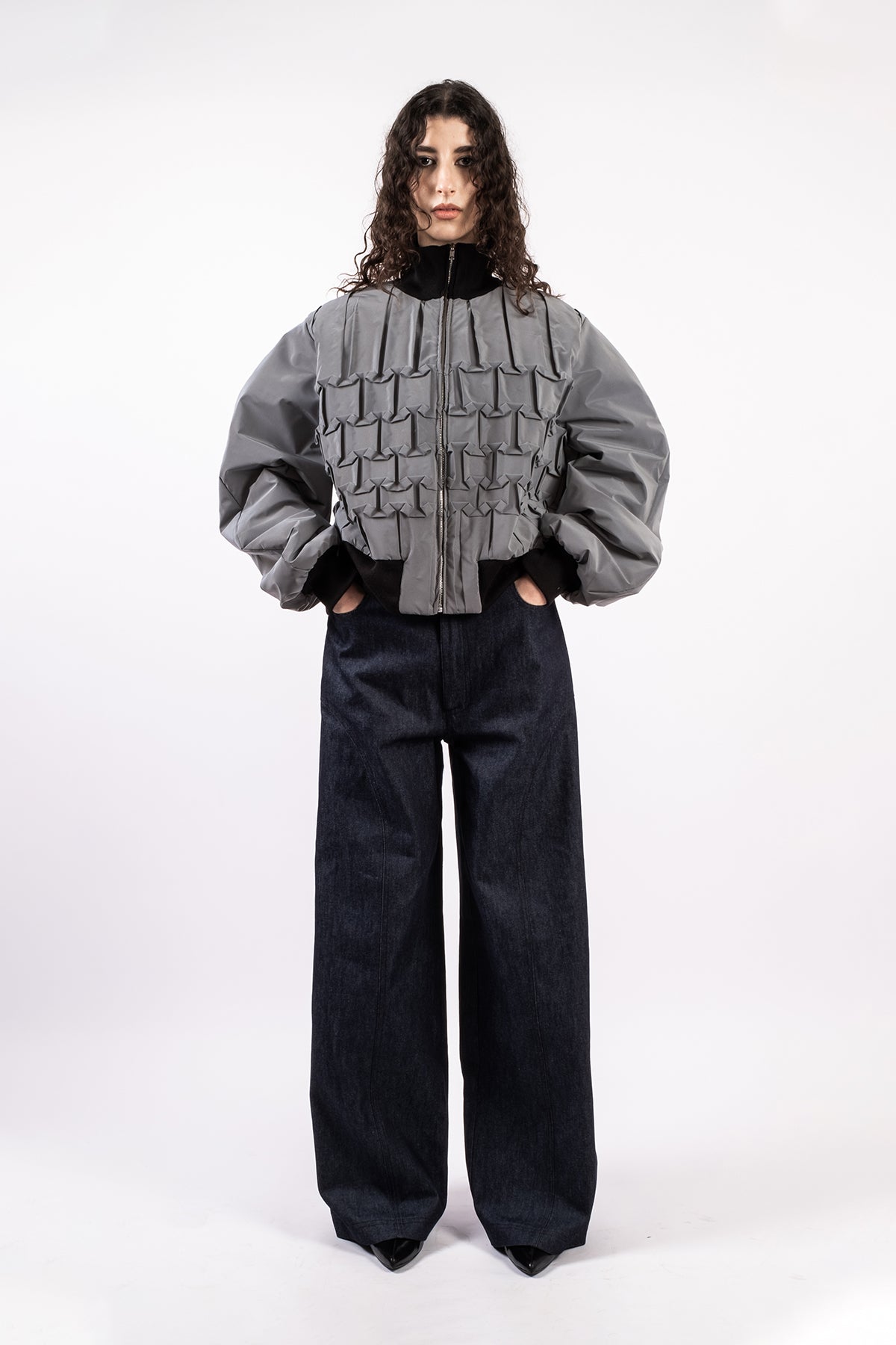 Reflective hand-pleated bomber