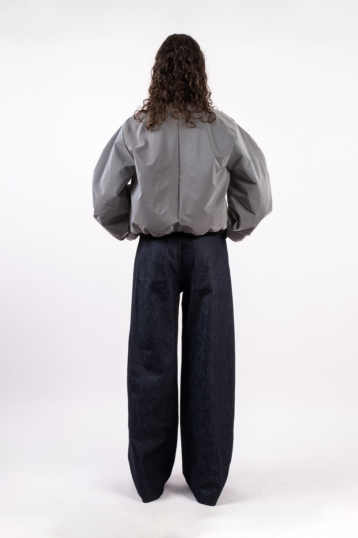 Reflective hand-pleated bomber