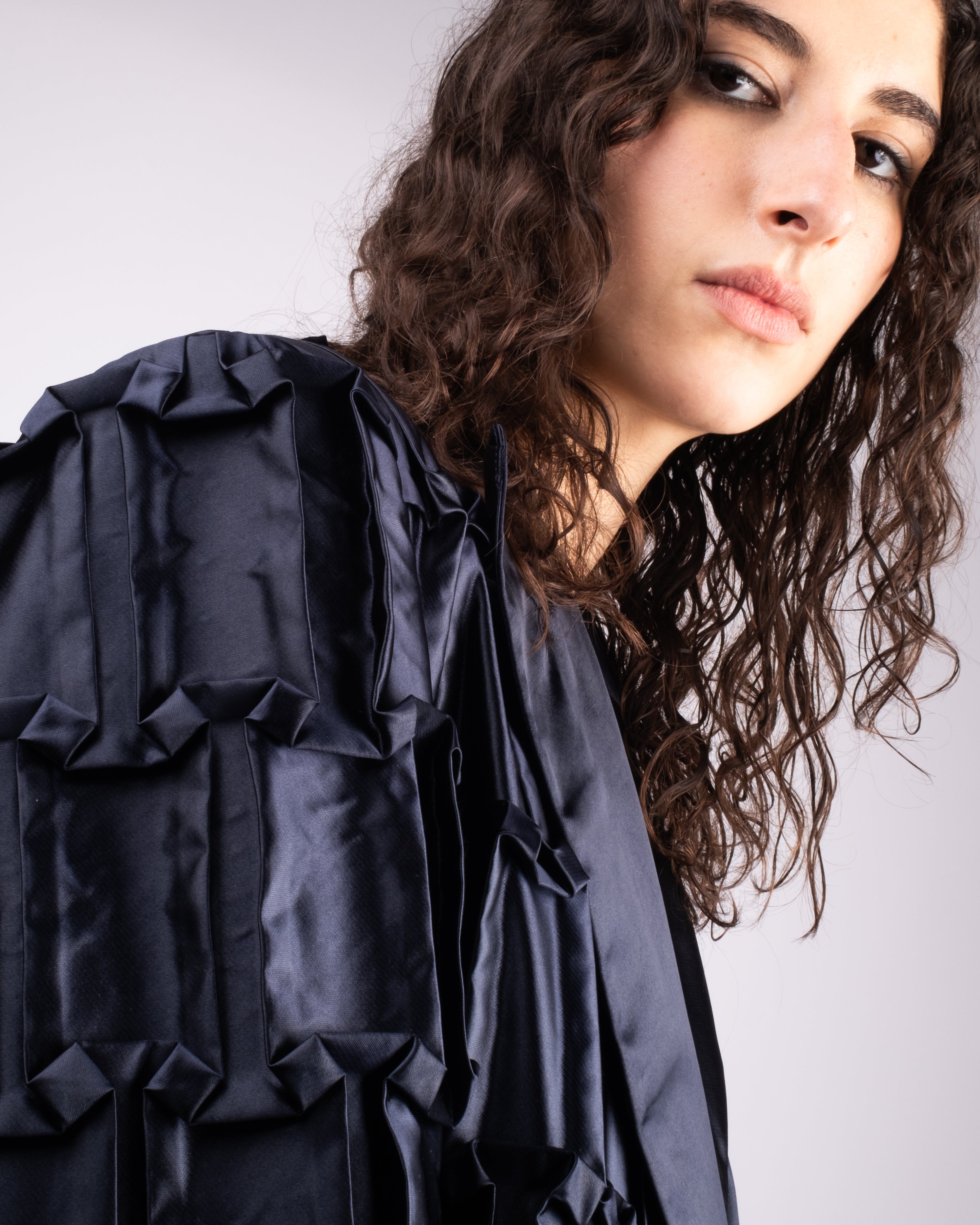 Oversized jacket in hand-crafted pleats