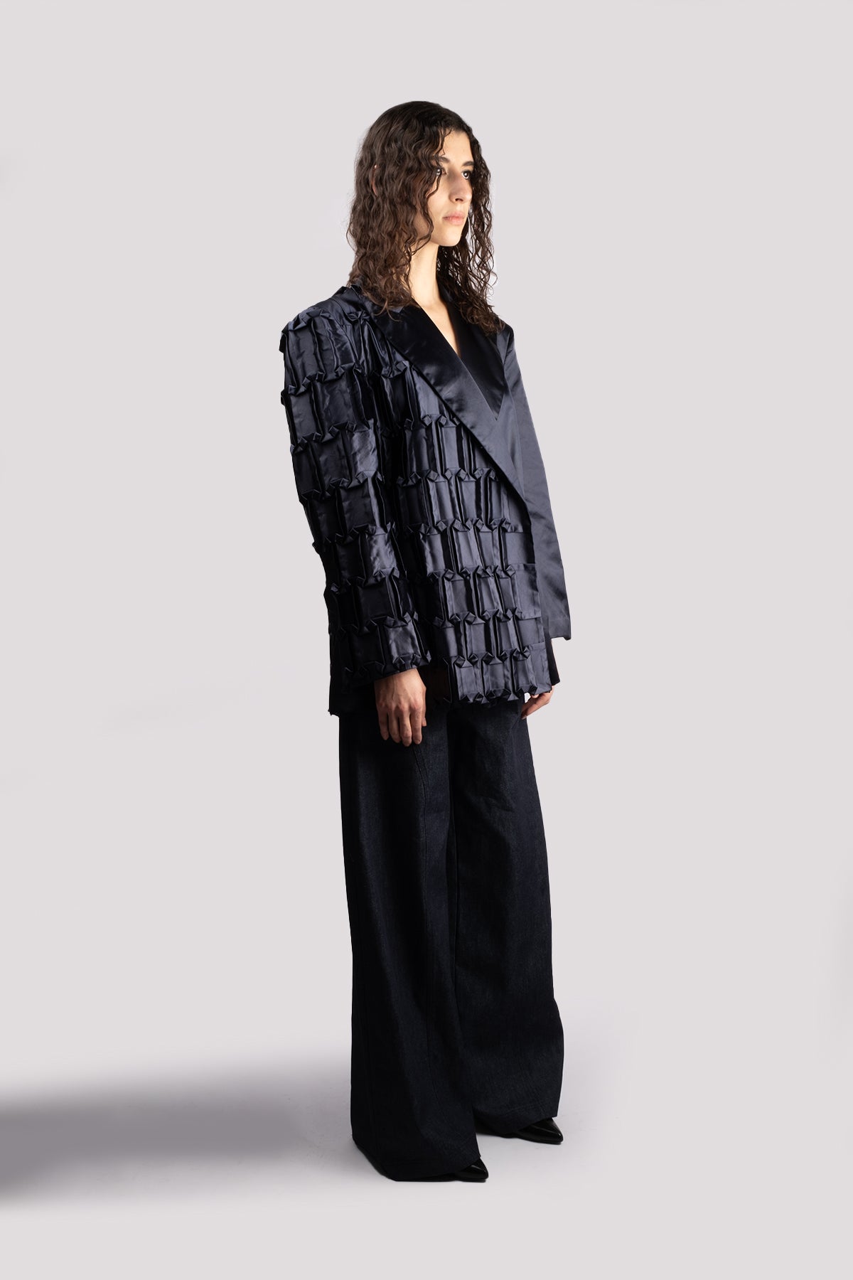 Oversized jacket in hand-crafted pleats