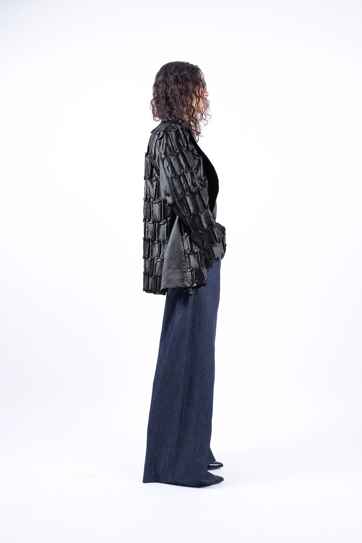 Oversized jacket in hand-crafted pleats