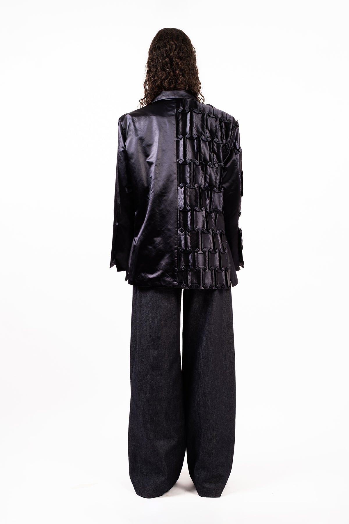 Oversized jacket in hand-crafted pleats