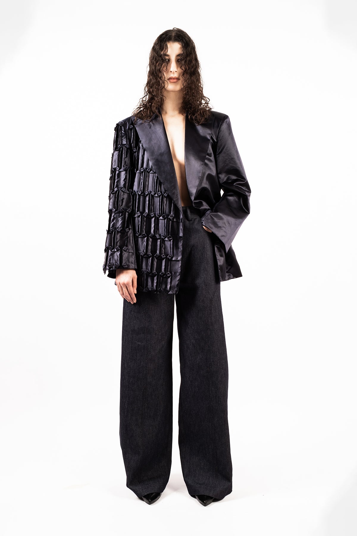 Oversized jacket in hand-crafted pleats